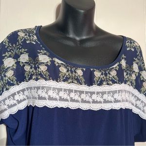 Blue blouse with chiffon at shoulders and lace trim. Sweet and romantic. Size XL
